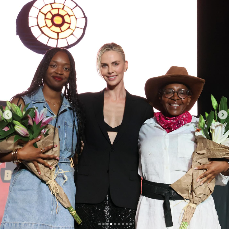 Charlize Theron with guests at the annual Block Party hosted by the Charlize Theron Africa Outreach Project (CTAOP), posted in July 2024. | Source: Instagram/charlizeafrica