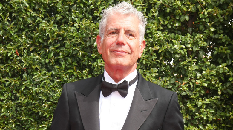 Anthony Bourdain wearing tuxedo outside